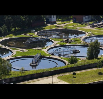 Aerial view of storage tanks in sewage water treatment plant.
